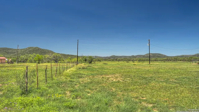 a view of an ocean with a mountain view