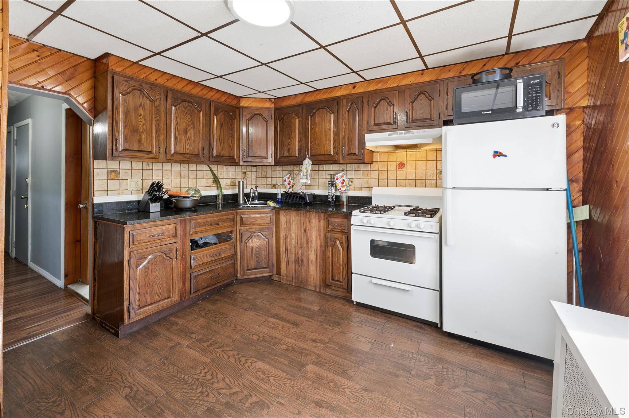 976 Sacket Avenue Bronx, NY 10462 - Photo 15 of 20 a kitchen with a stove a refrigerator and a sink