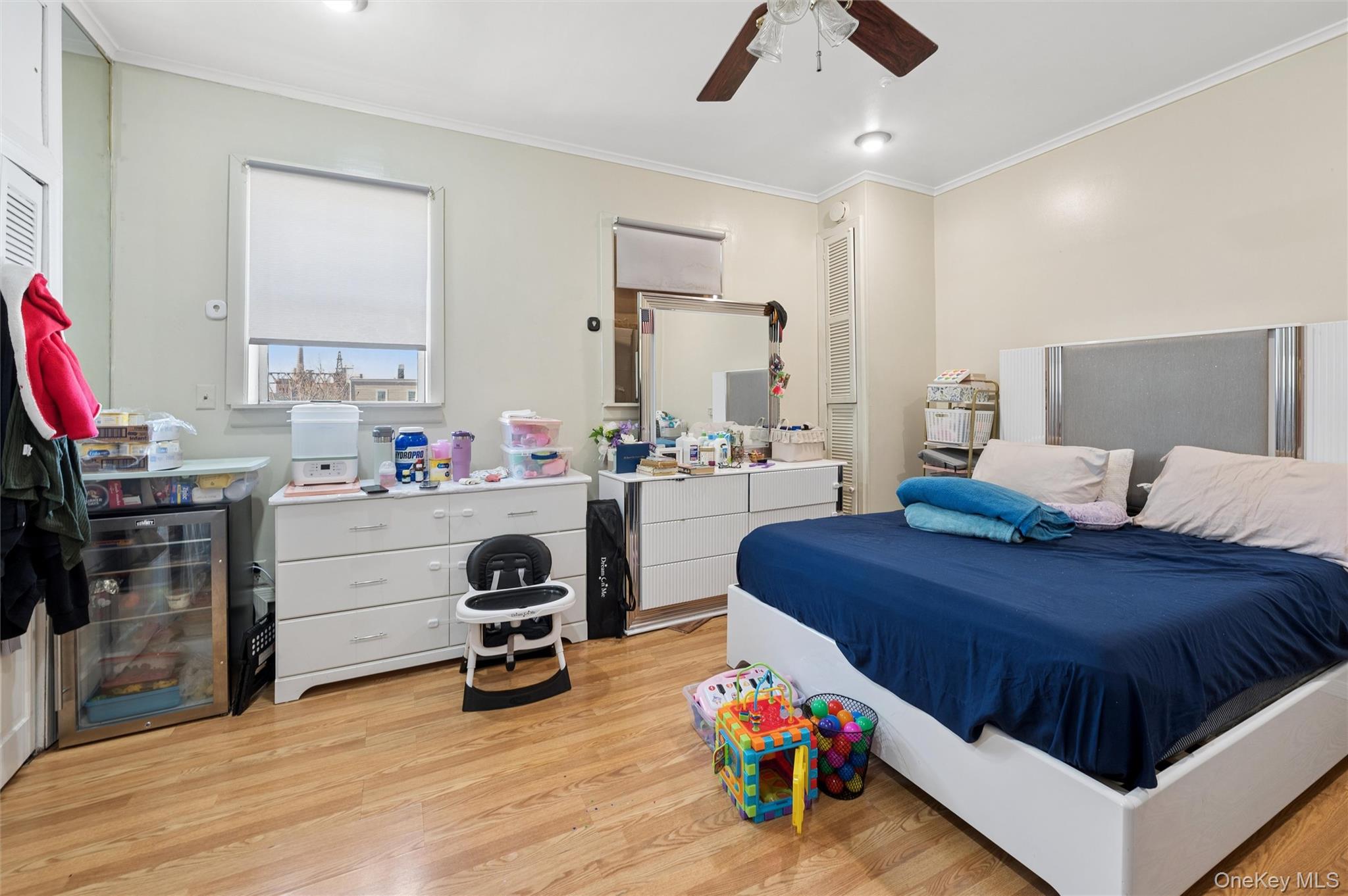 976 Sacket Avenue Bronx, NY 10462 - Photo 17 of 20 a bedroom with a bed and a window