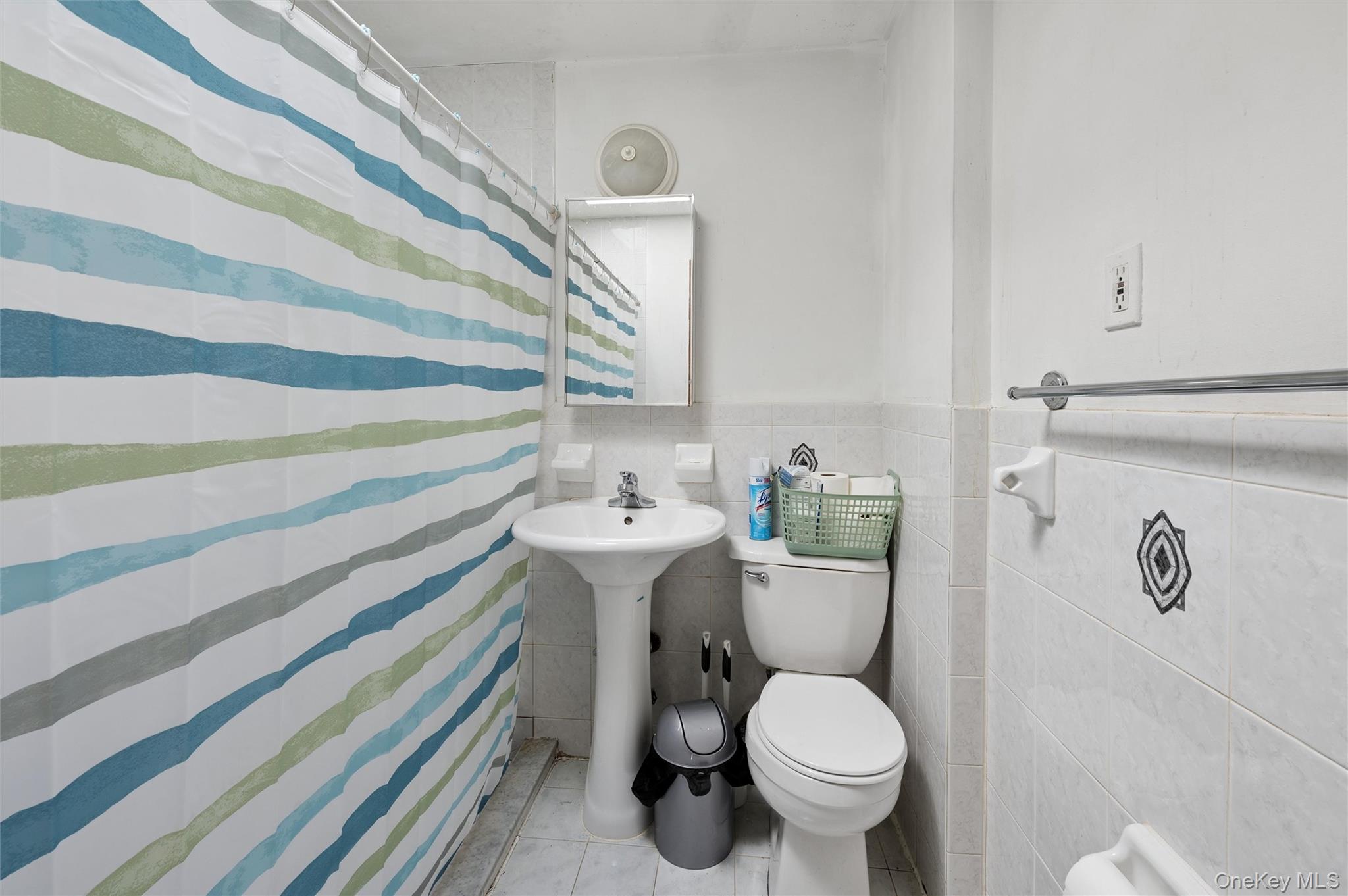 976 Sacket Avenue Bronx, NY 10462 - Photo 20 of 20 a bathroom with a toilet and a sink