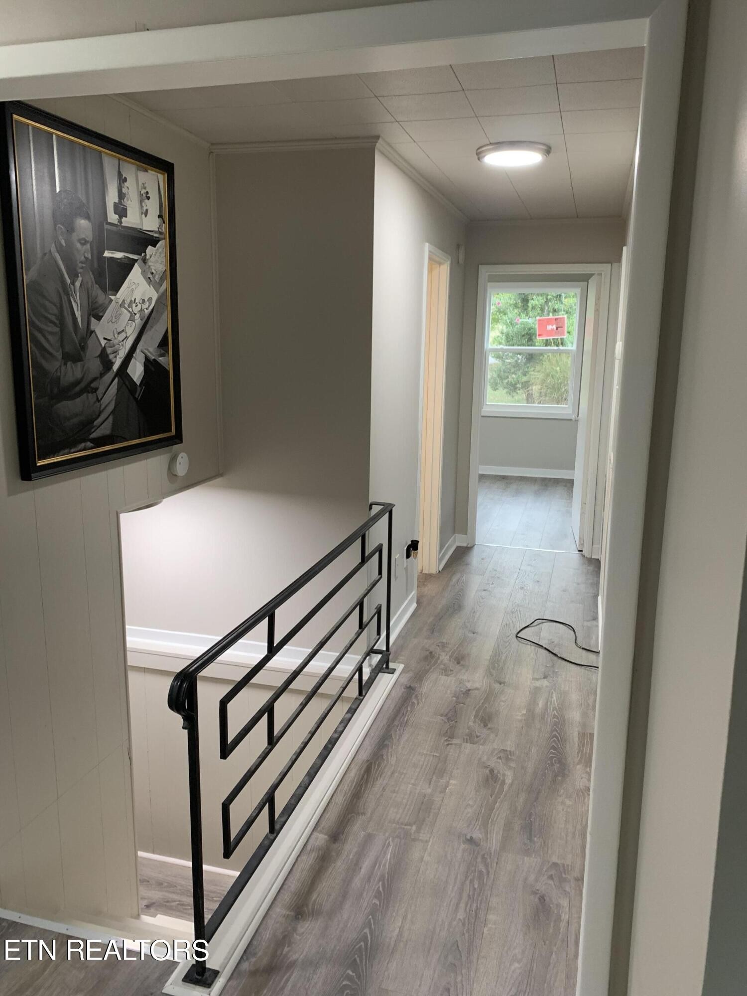 102 Audubon Road Oak Ridge, TN 37830 - Photo 3 of 19 a view of a hallway with paintings on the wall