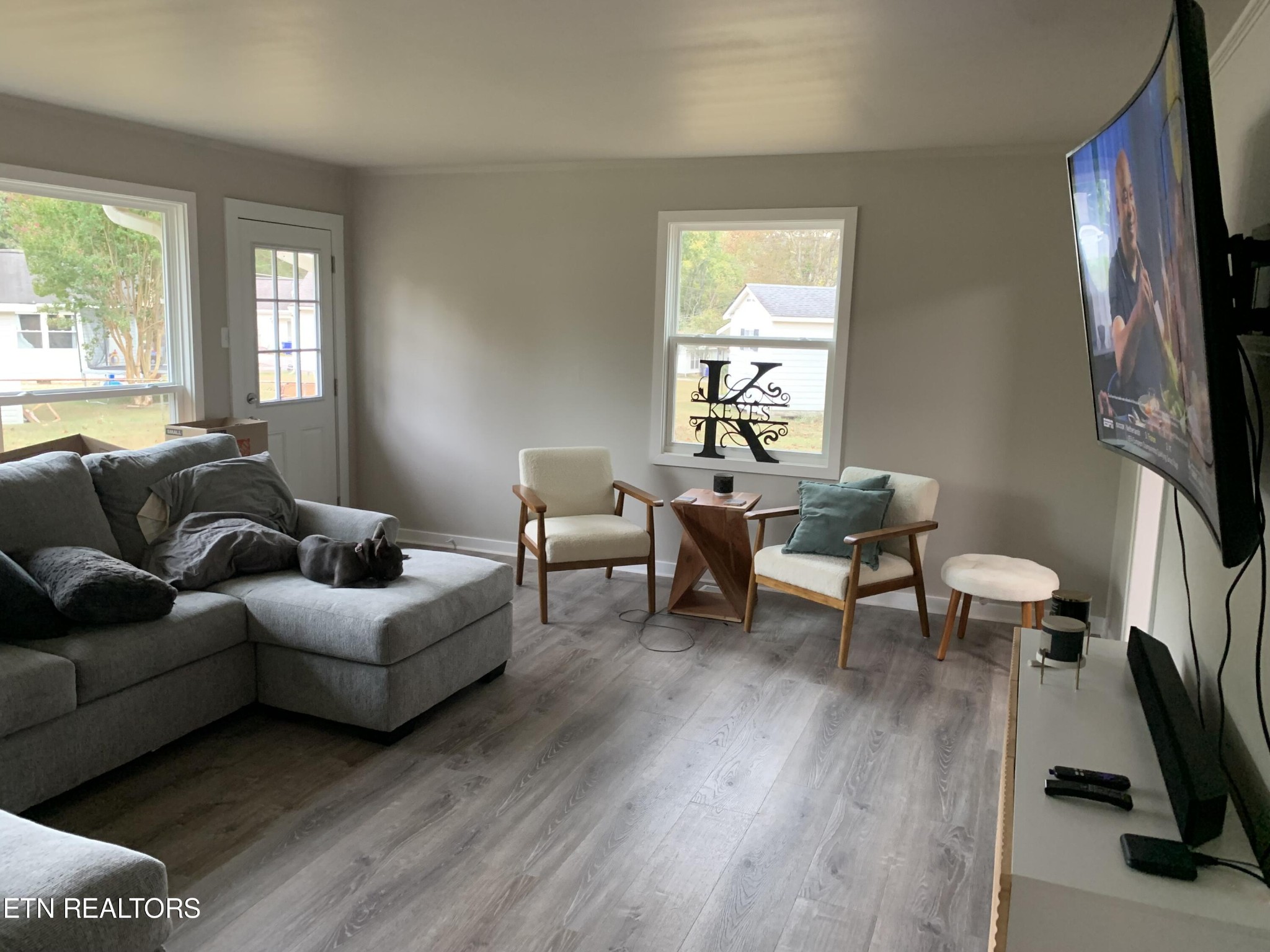 102 Audubon Road Oak Ridge, TN 37830 - Photo 5 of 19 a living room with furniture a flat screen tv and a window