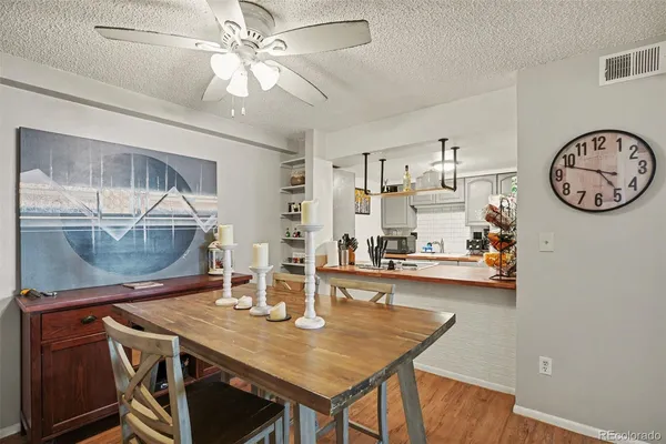 a dining room with a table and chairs
