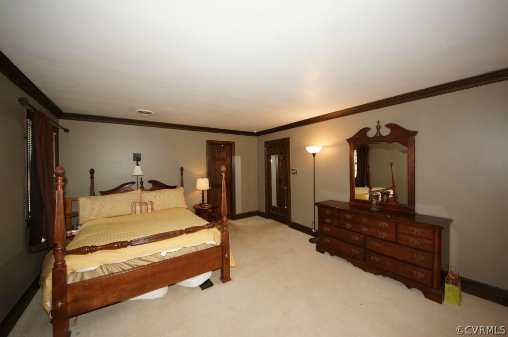 2400 Castlebridge Road Midlothian, VA 23113 - Photo 11 of 12 a spacious bedroom with a bed and window