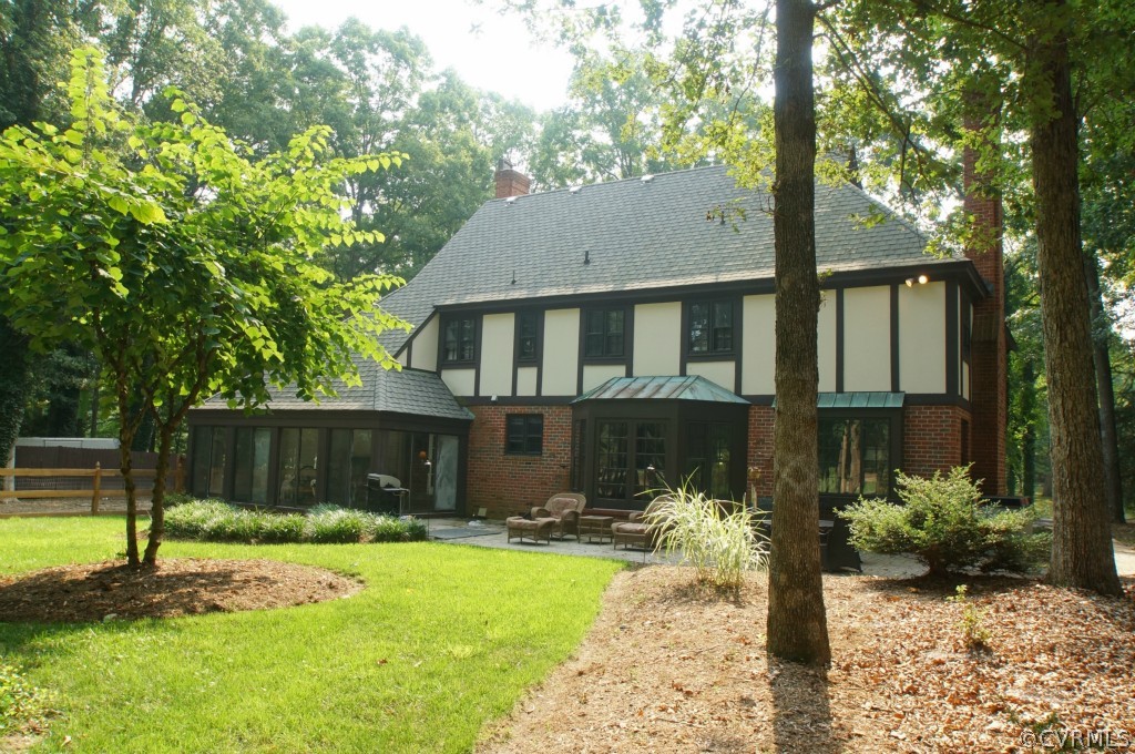 2400 Castlebridge Road Midlothian, VA 23113 - Photo 2 of 12 a front view of a house with a yard and a fence
