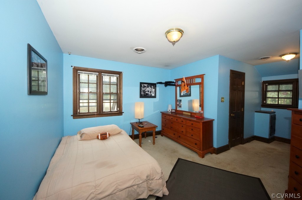 2400 Castlebridge Road Midlothian, VA 23113 - Photo 6 of 12 a bedroom with a bed and wooden floor
