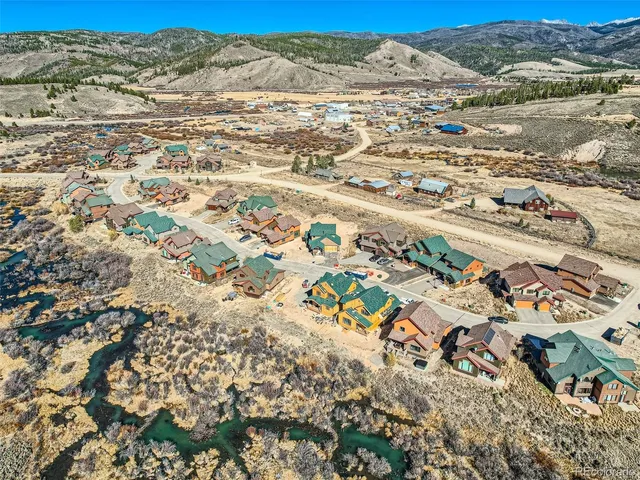 an aerial view of residential building and ocean