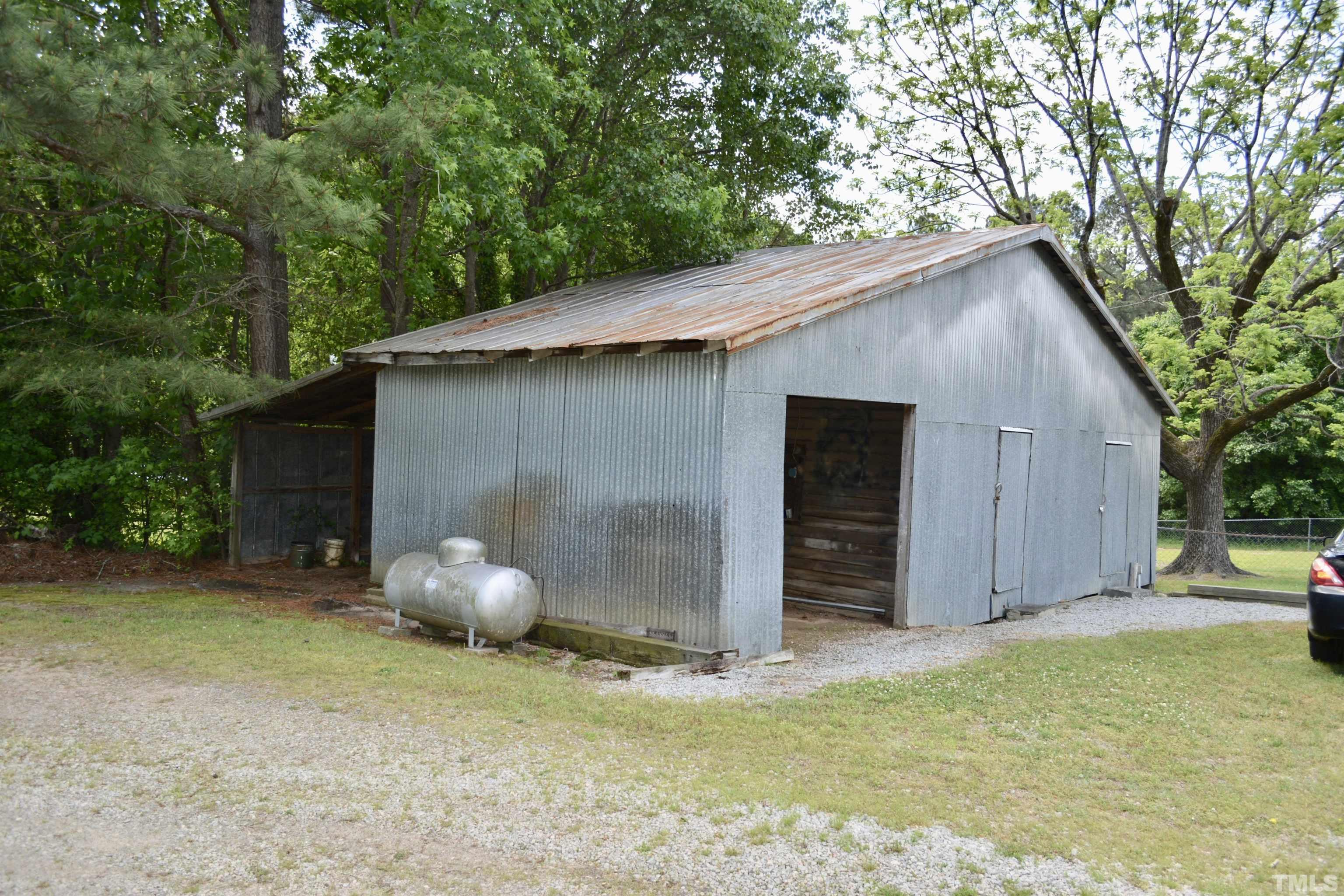 8837 Ransdell Road Raleigh, NC 27603 - Photo 14 of 48 a backyard of a house