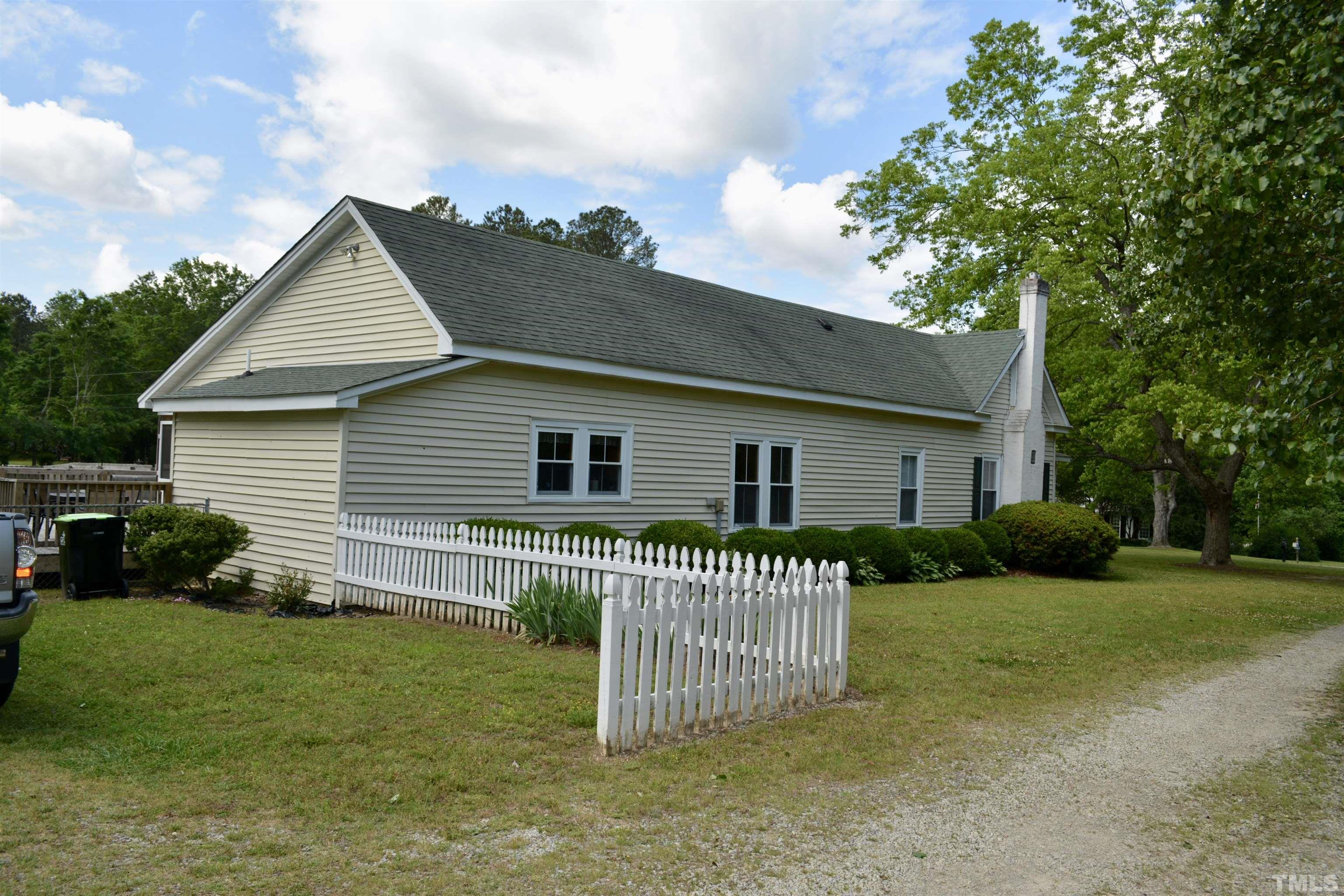 8837 Ransdell Road Raleigh, NC 27603 - Photo 19 of 48 a front view of a house with a garden