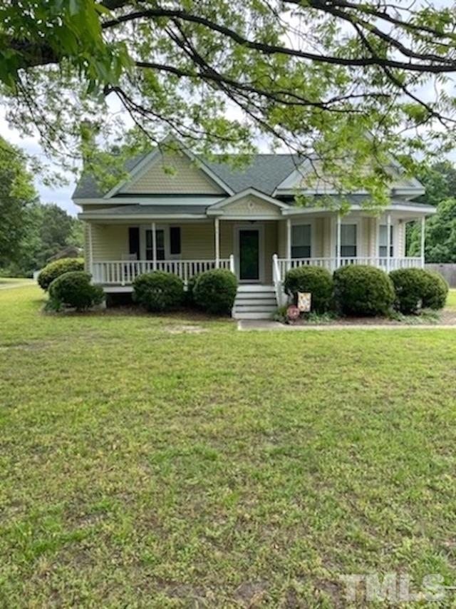 8837 Ransdell Road Raleigh, NC 27603 - Photo 2 of 48 a view of a house with a yard