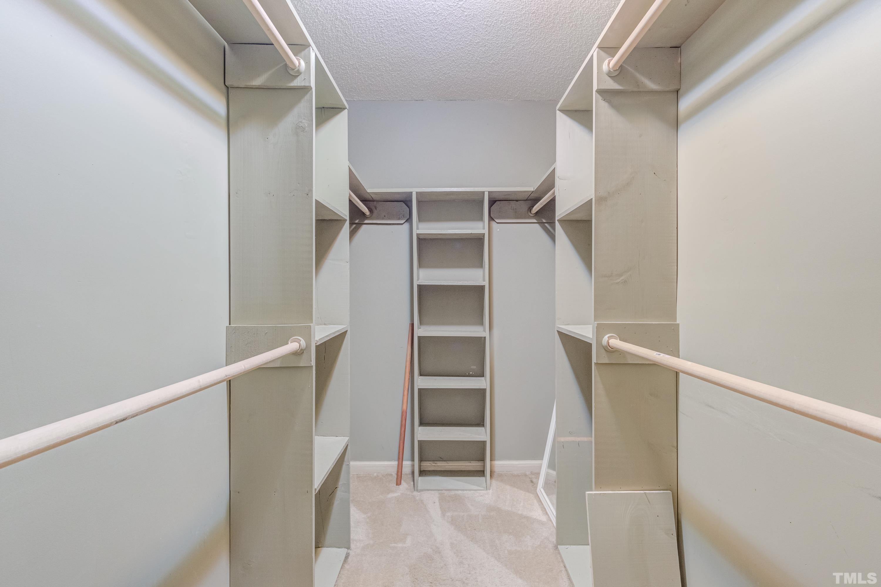 8837 Ransdell Road Raleigh, NC 27603 - Photo 28 of 48 a view of walk in closet with empty racks