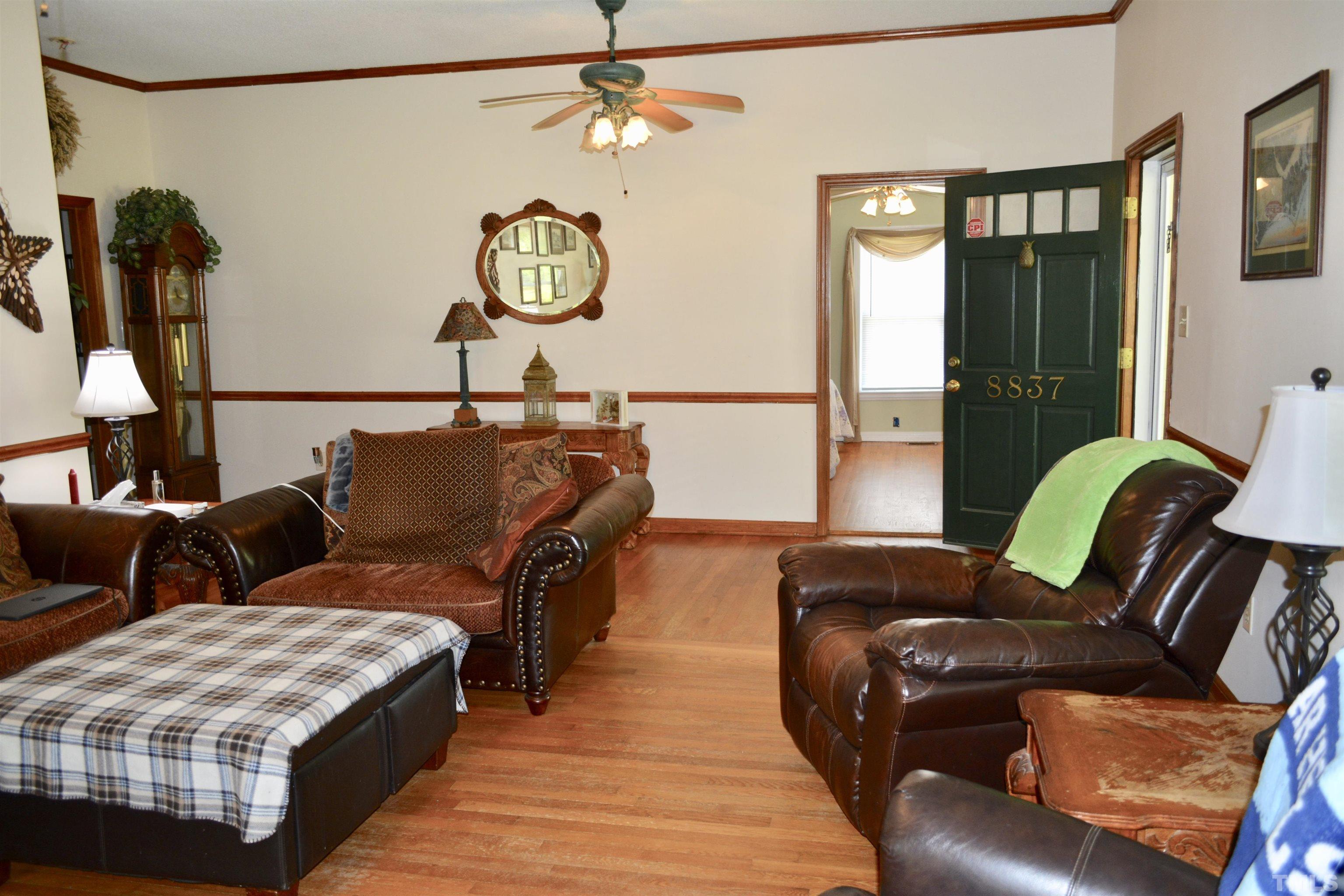 8837 Ransdell Road Raleigh, NC 27603 - Photo 3 of 48 a living room with furniture and a window