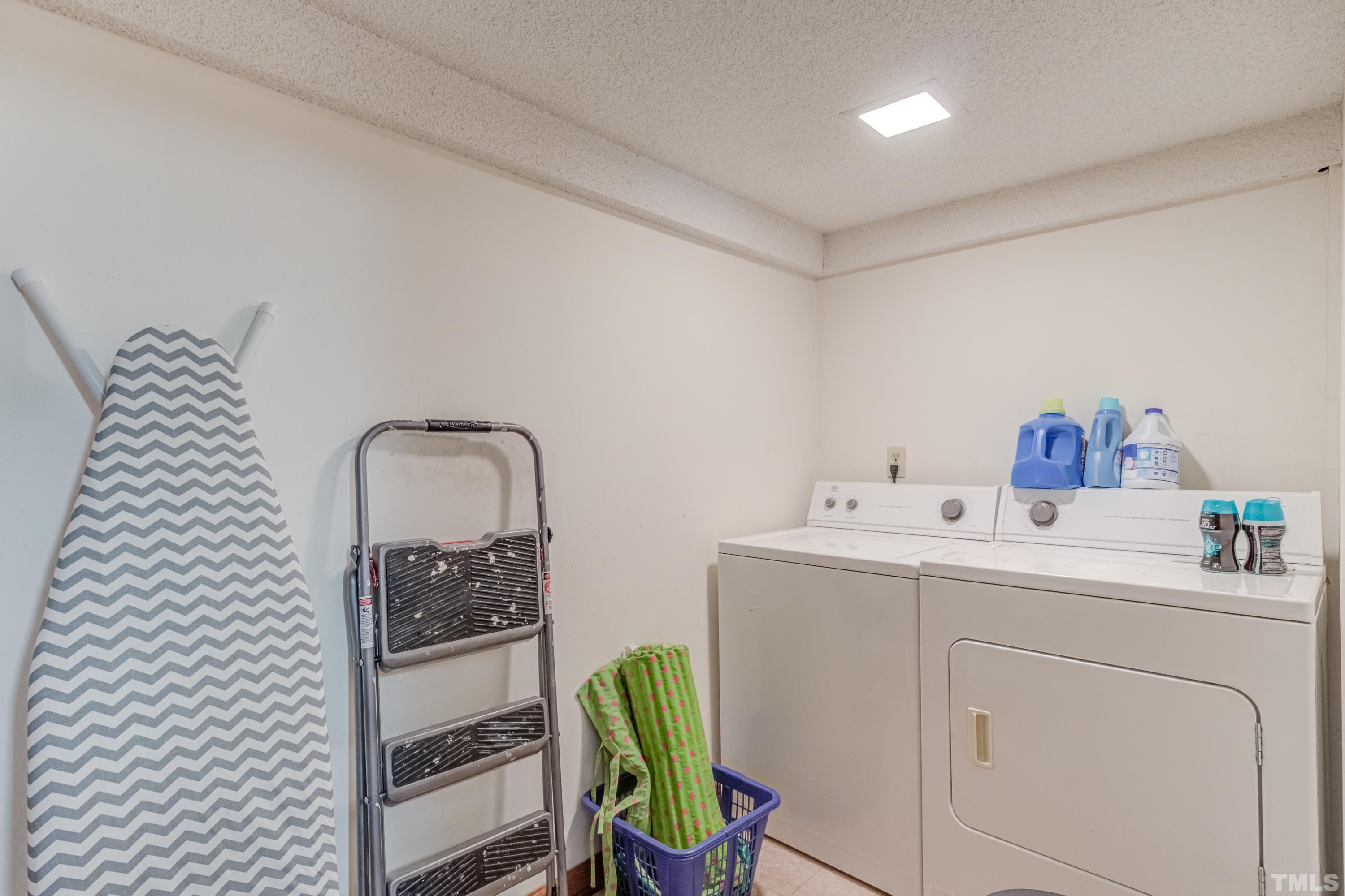 8837 Ransdell Road Raleigh, NC 27603 - Photo 34 of 48 a utility room with dryer and washer