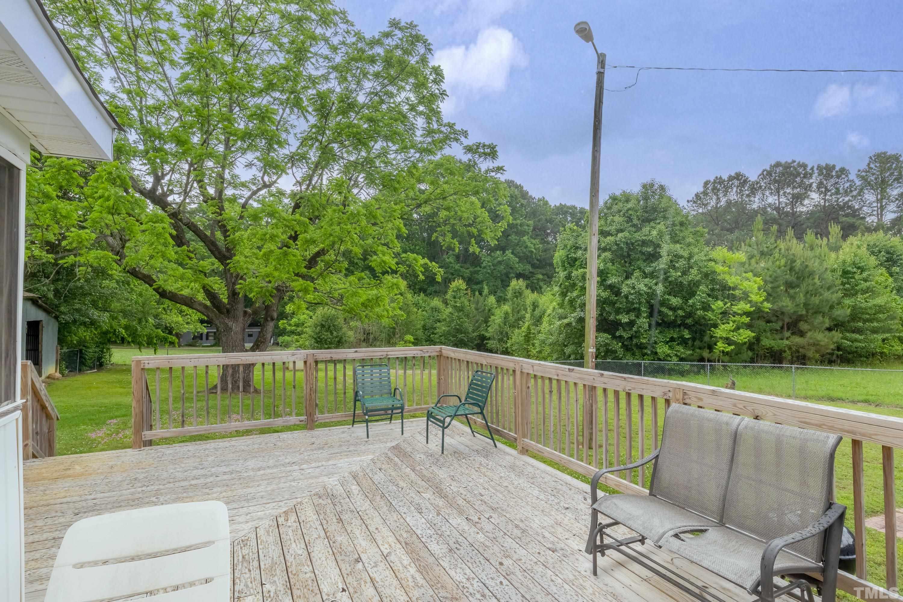 8837 Ransdell Road Raleigh, NC 27603 - Photo 36 of 48 a view of a two chairs on the roof deck