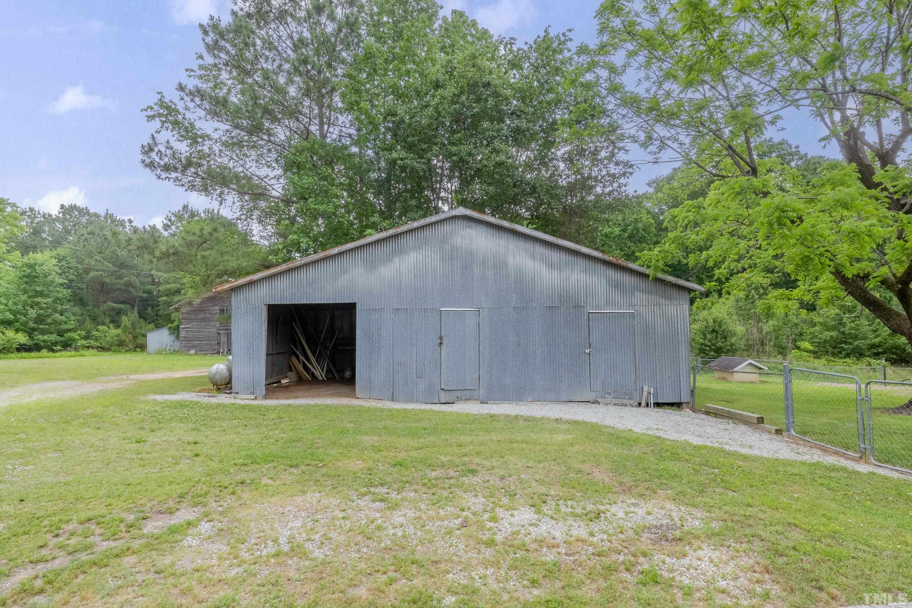8837 Ransdell Road Raleigh, NC 27603 - Photo 46 of 48 a house with a yard