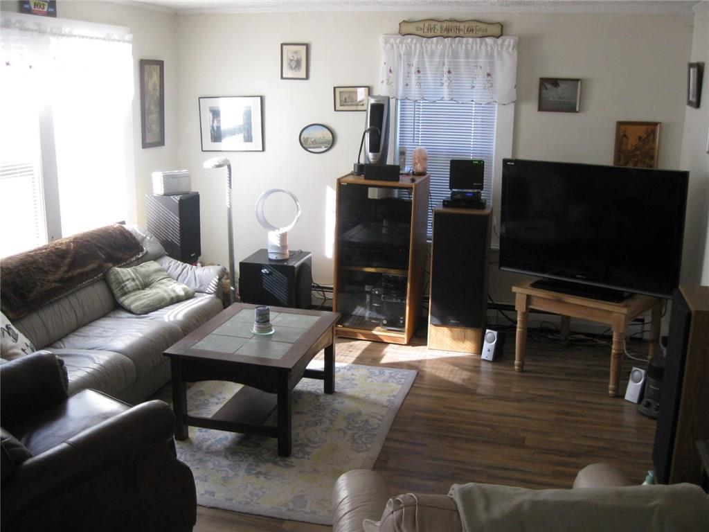 437 Togus Road Chelsea, ME 04330 - Photo 7 of 14 Living Room with newer laminate floor