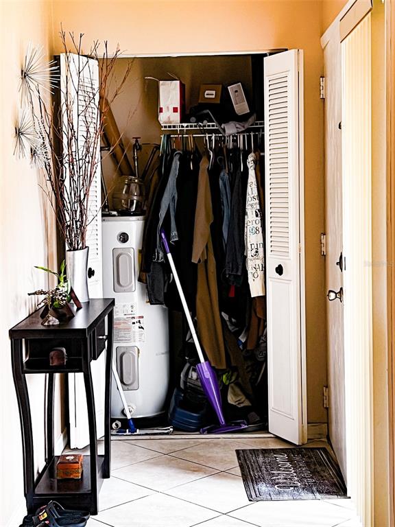 366 Diamond Street Deltona, FL 32725 - Photo 11 of 24 a view of walk in closet with clothes and shoes