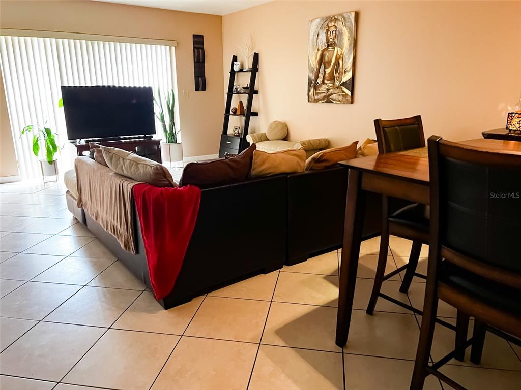366 Diamond Street Deltona, FL 32725 - Photo 16 of 24 a living room with furniture and a flat screen tv