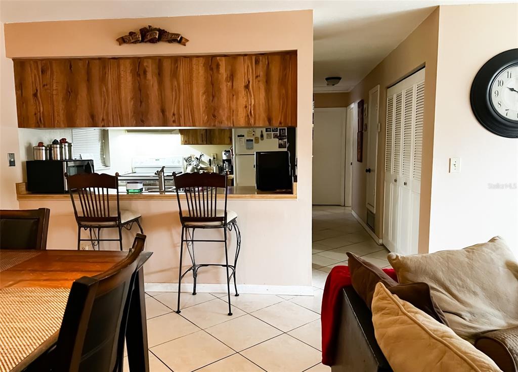 366 Diamond Street Deltona, FL 32725 - Photo 17 of 24 a living room with furniture a window and a kitchen