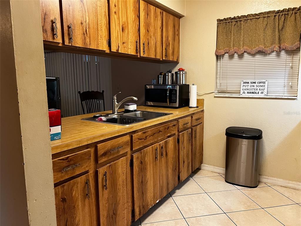 366 Diamond Street Deltona, FL 32725 - Photo 19 of 24 a kitchen with a sink cabinets and appliances