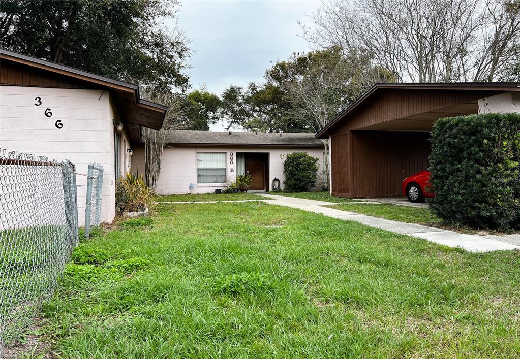366 Diamond Street Deltona, FL 32725 - Photo 2 of 24 a front view of a house with garden