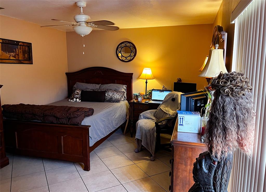 366 Diamond Street Deltona, FL 32725 - Photo 23 of 24 a bed room with a bed and a lamp