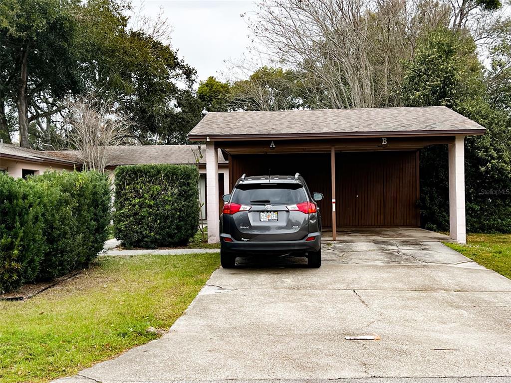 366 Diamond Street Deltona, FL 32725 - Photo 3 of 24 a car parked in front of white house
