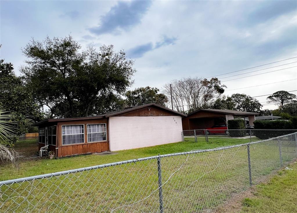 366 Diamond Street Deltona, FL 32725 - Photo 5 of 24 a front view of a house with garden