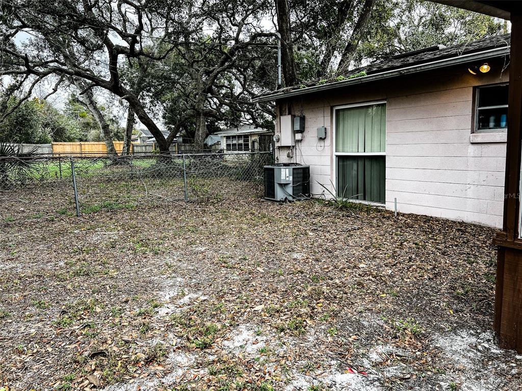 366 Diamond Street Deltona, FL 32725 - Photo 6 of 24 a view of backyard of house with green space
