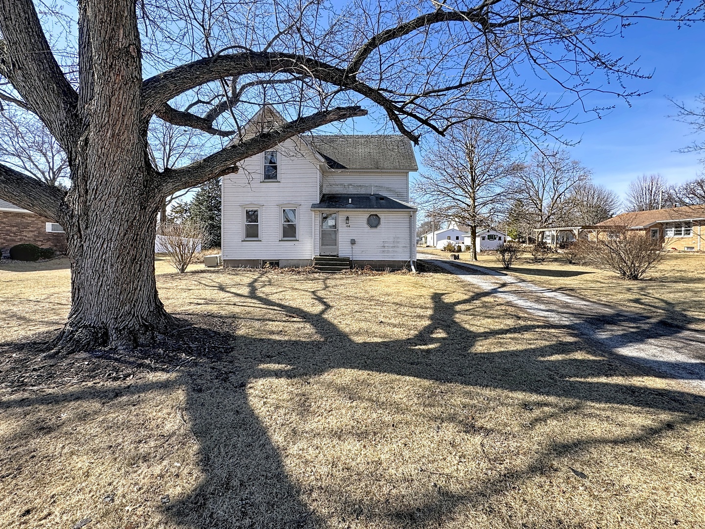 108 South Yates Street Alpha, IL 61413 - Photo 1 of 15 a view of a yard with a large tree