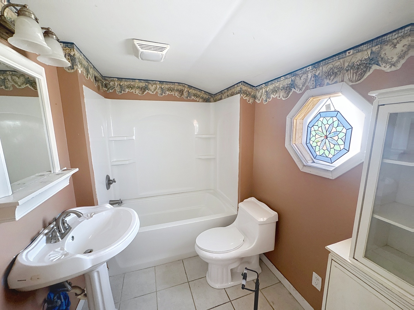 108 South Yates Street Alpha, IL 61413 - Photo 8 of 15 a bathroom with a sink toilet and shower