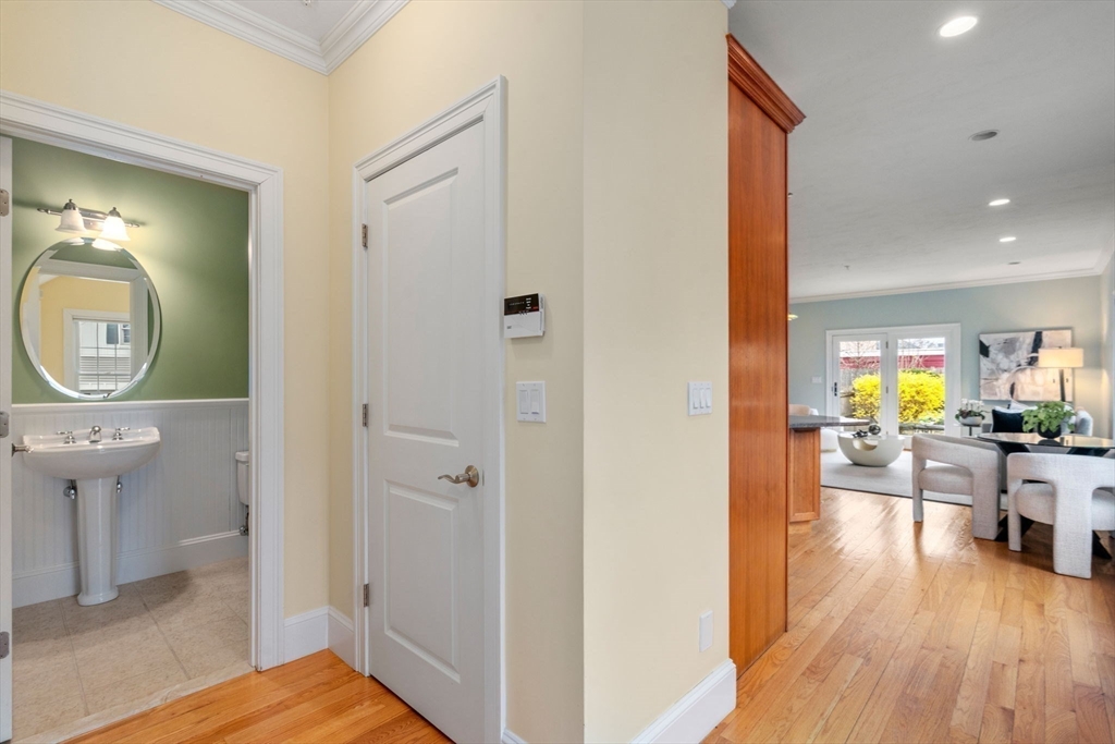 18 Maple Court, Unit 18 Needham, MA 02492 - Photo 12 of 25 a view of a living room and bathroom with a wooden floor