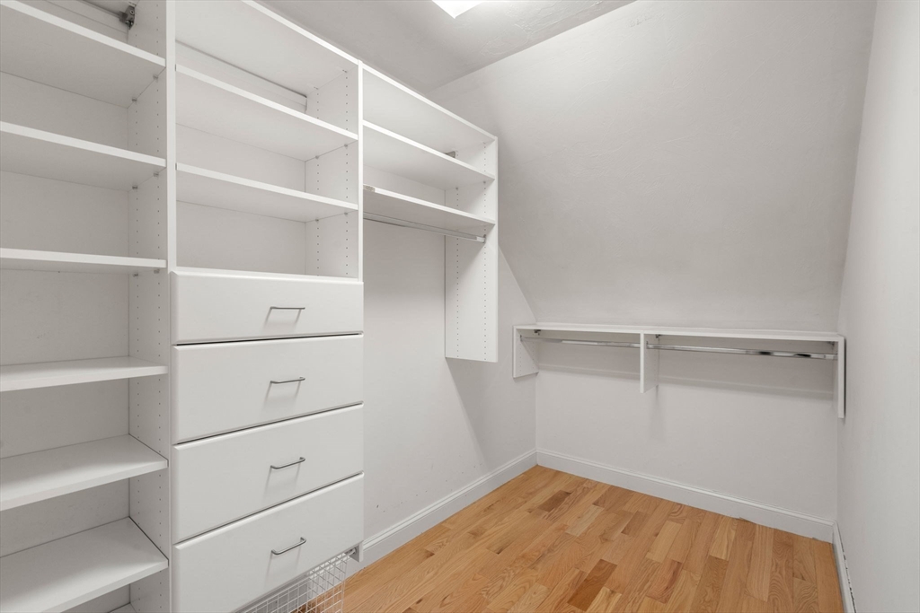 18 Maple Court, Unit 18 Needham, MA 02492 - Photo 18 of 25 a view of an empty walk in closet