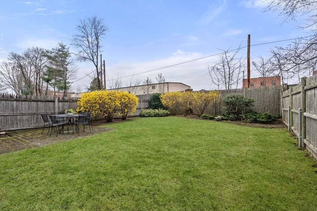 18 Maple Court, Unit 18 Needham, MA 02492 - Photo 25 of 25 a view of a backyard