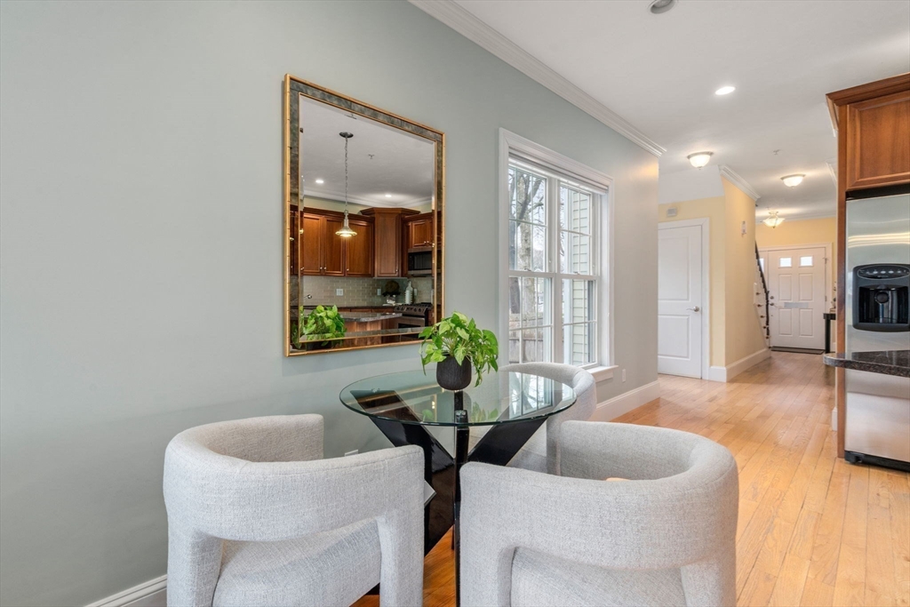 18 Maple Court, Unit 18 Needham, MA 02492 - Photo 10 of 25 a living room with furniture and wooden floor