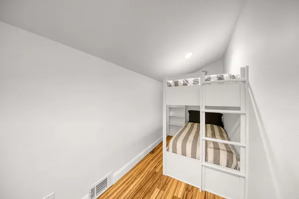 a view of staircase and kitchen with sink