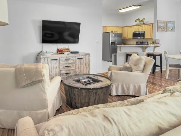 a bedroom with furniture and a flat screen tv