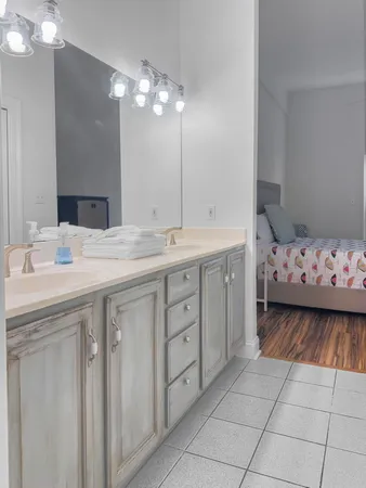 a bathroom with a sink vanity and mirror