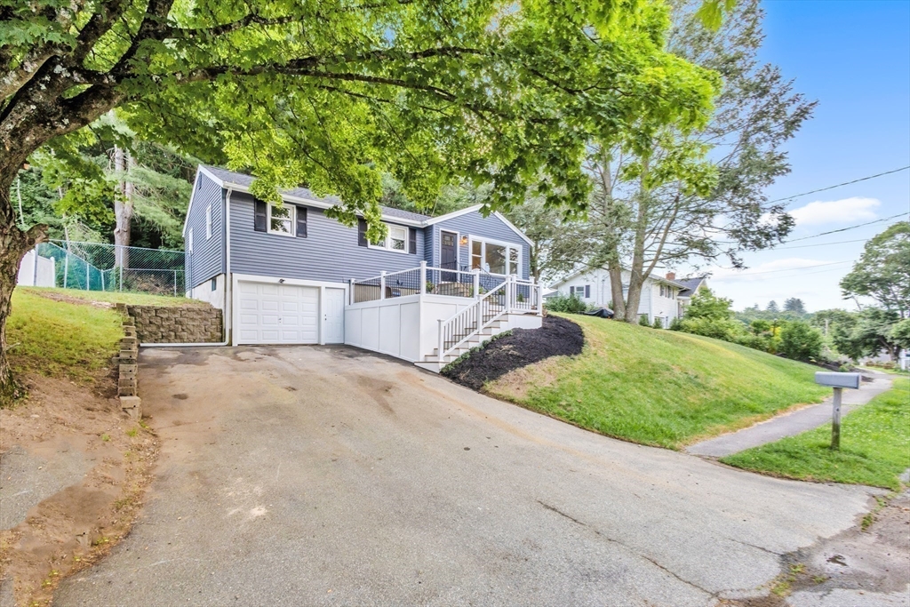 33 Ontario Drive Hudson, MA 01749 - Photo 24 of 36 a front view of a house with a yard and garage