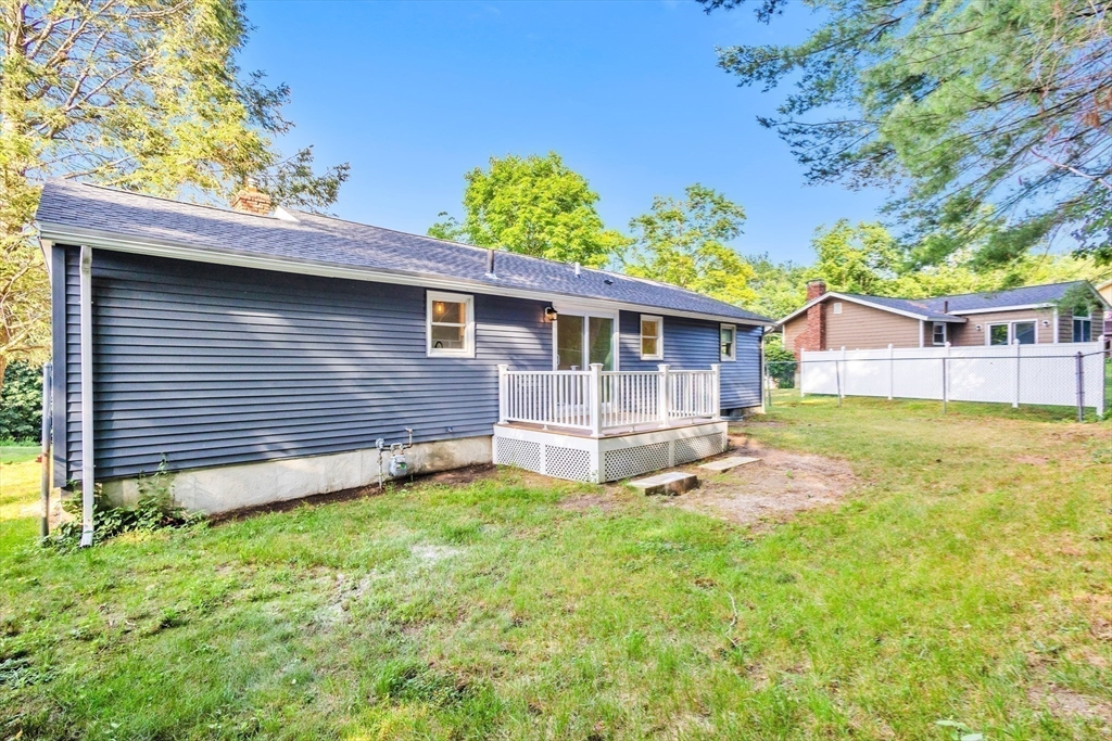33 Ontario Drive Hudson, MA 01749 - Photo 27 of 36 a view of a house with a yard and sitting area