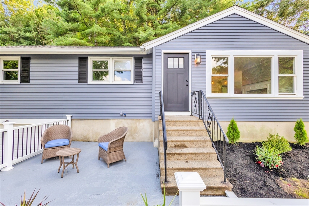 33 Ontario Drive Hudson, MA 01749 - Photo 3 of 36 a view of a patio with table and chairs and potted plants