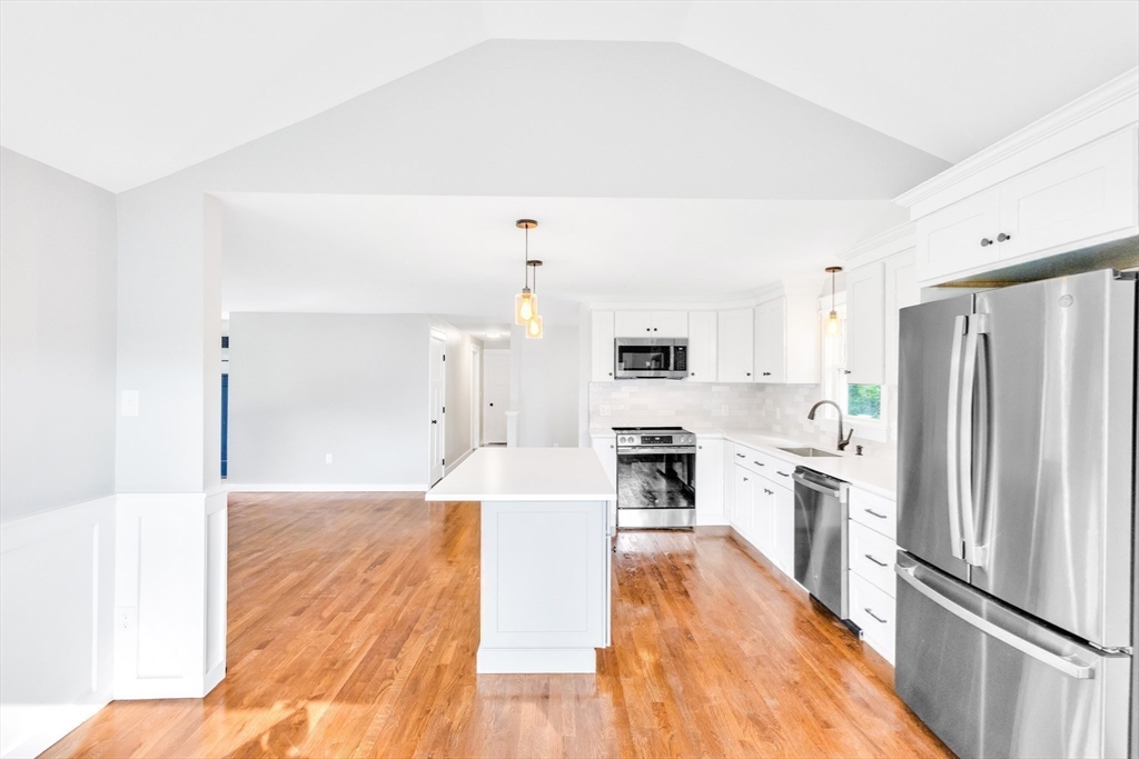 33 Ontario Drive Hudson, MA 01749 - Photo 10 of 36 a kitchen with stainless steel appliances a refrigerator and a stove top oven