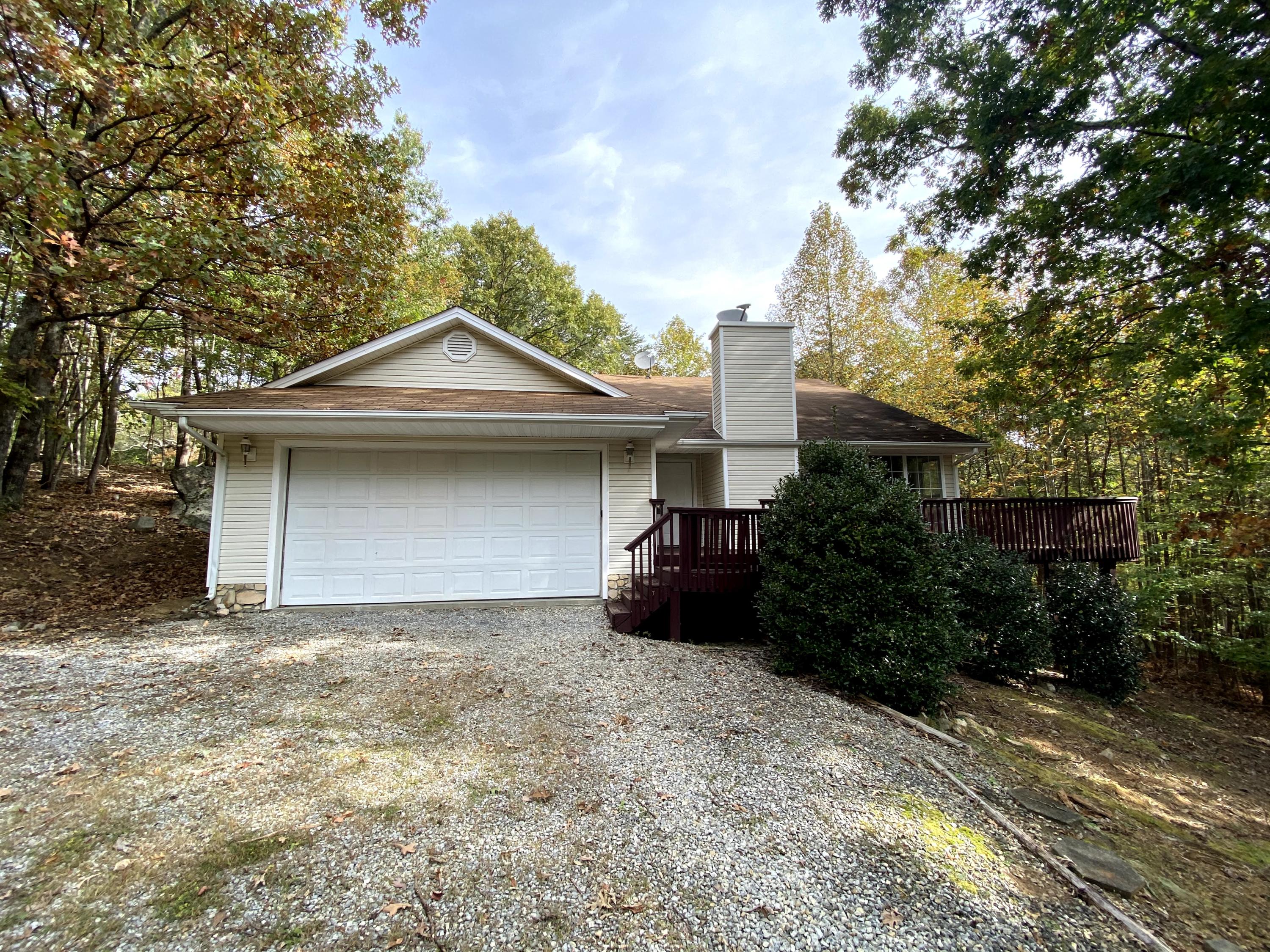 35 Silver Lake Road Hardy, VA 24101 - Photo 2 of 47 a front view of a house with a yard and garage