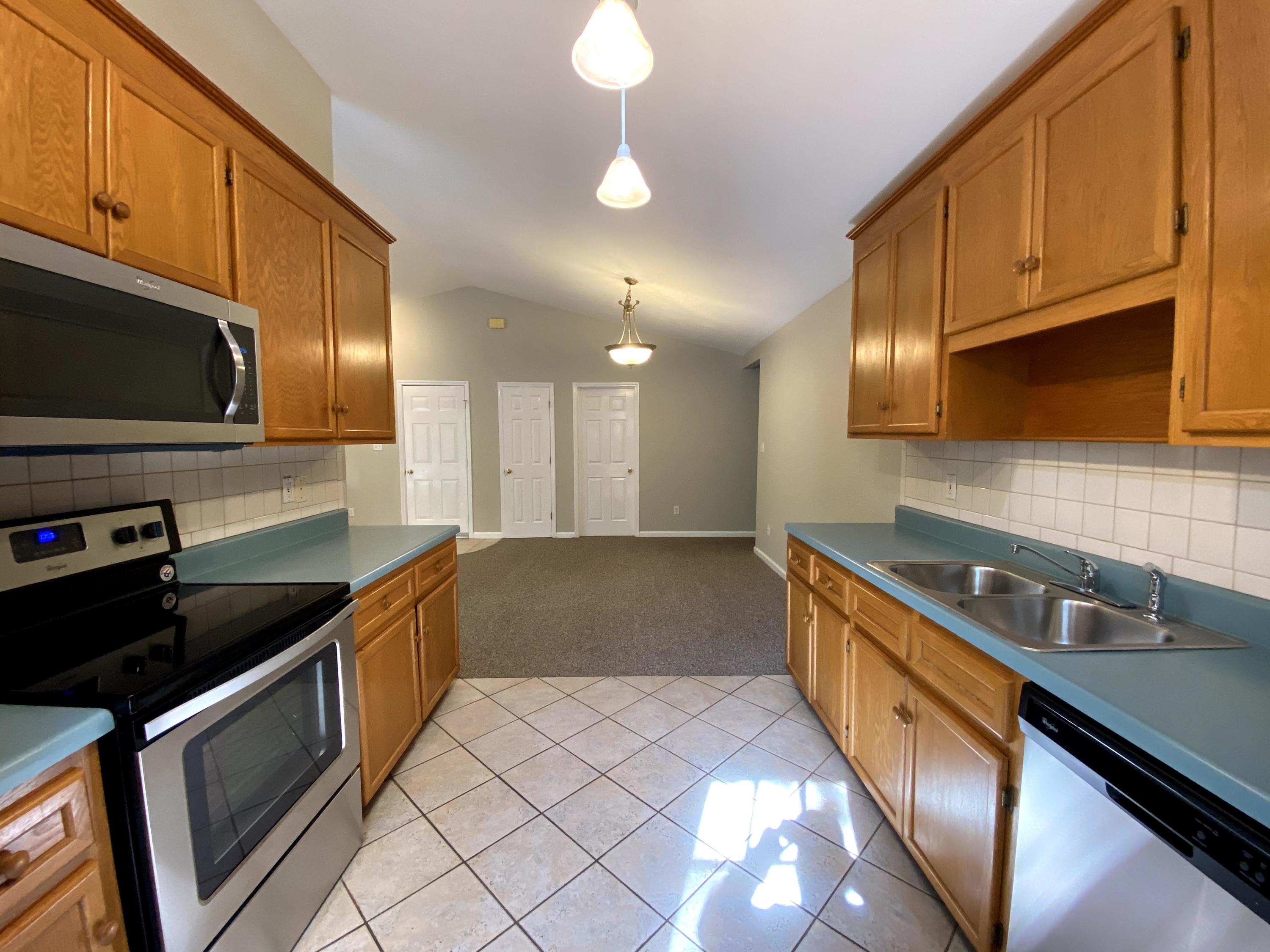 35 Silver Lake Road Hardy, VA 24101 - Photo 14 of 47 a kitchen with granite countertop a sink a stove and cabinets