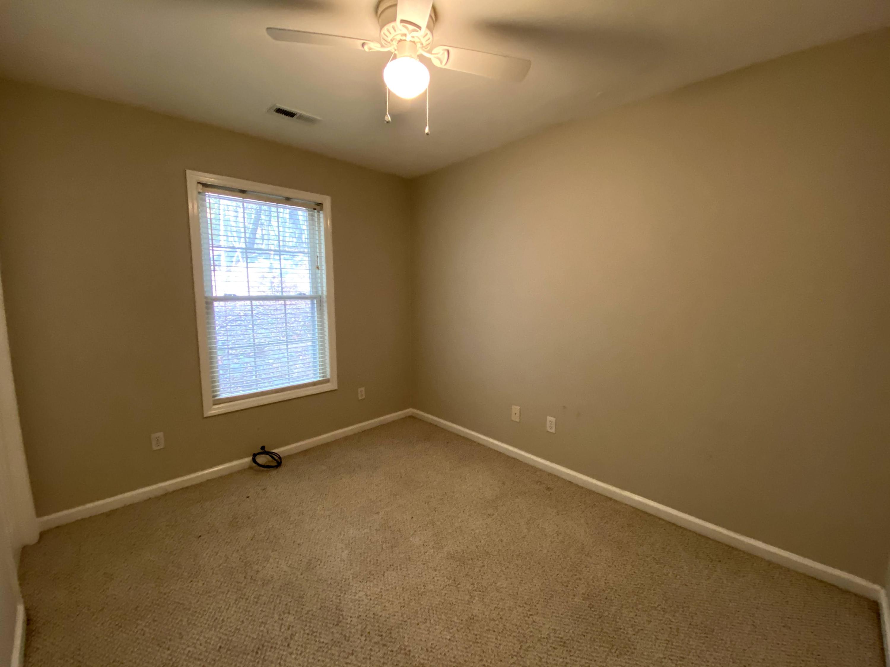 35 Silver Lake Road Hardy, VA 24101 - Photo 20 of 47 an empty room with a chandelier fan and windows