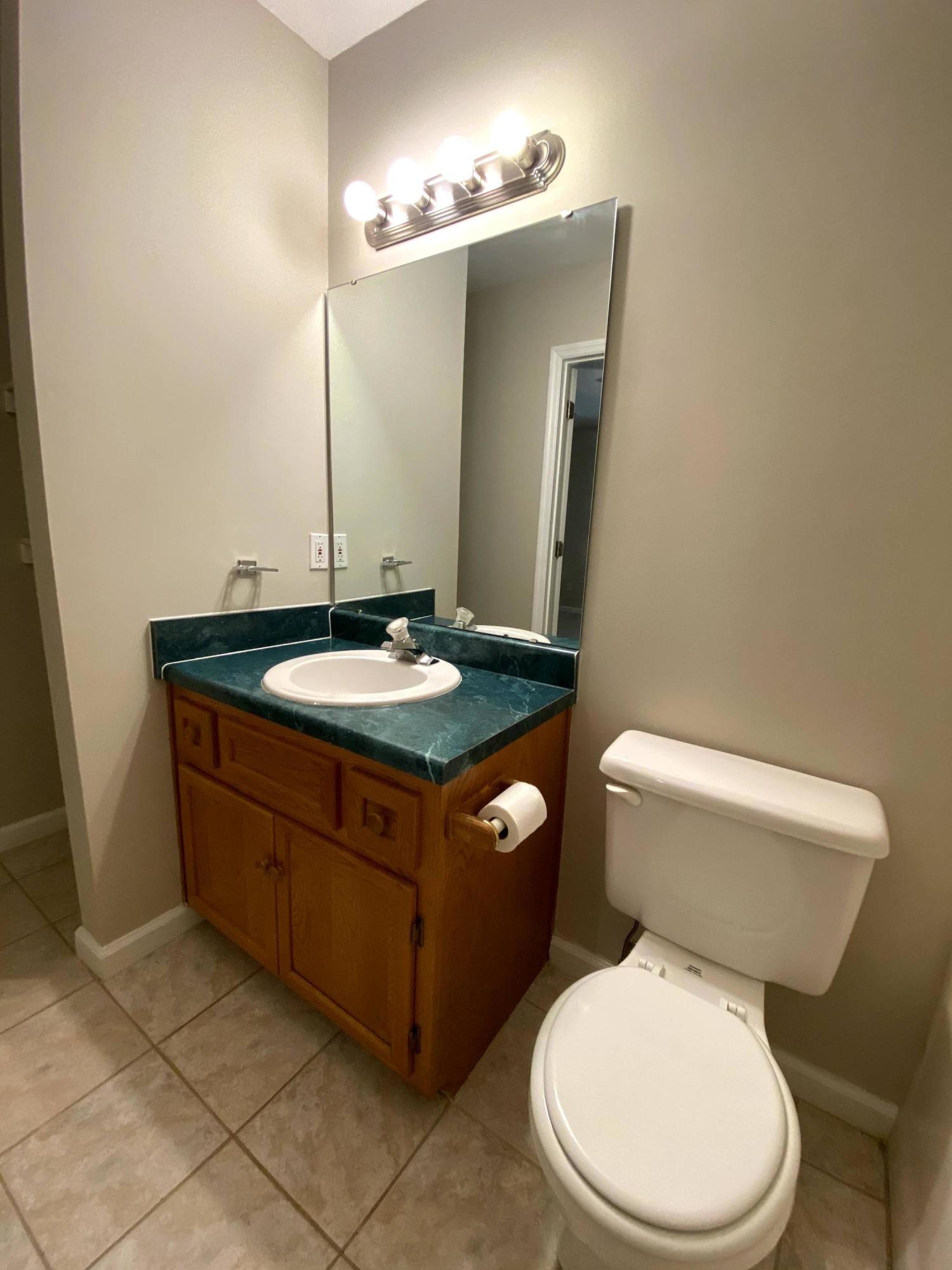 35 Silver Lake Road Hardy, VA 24101 - Photo 34 of 47 a bathroom with a granite countertop toilet sink and mirror