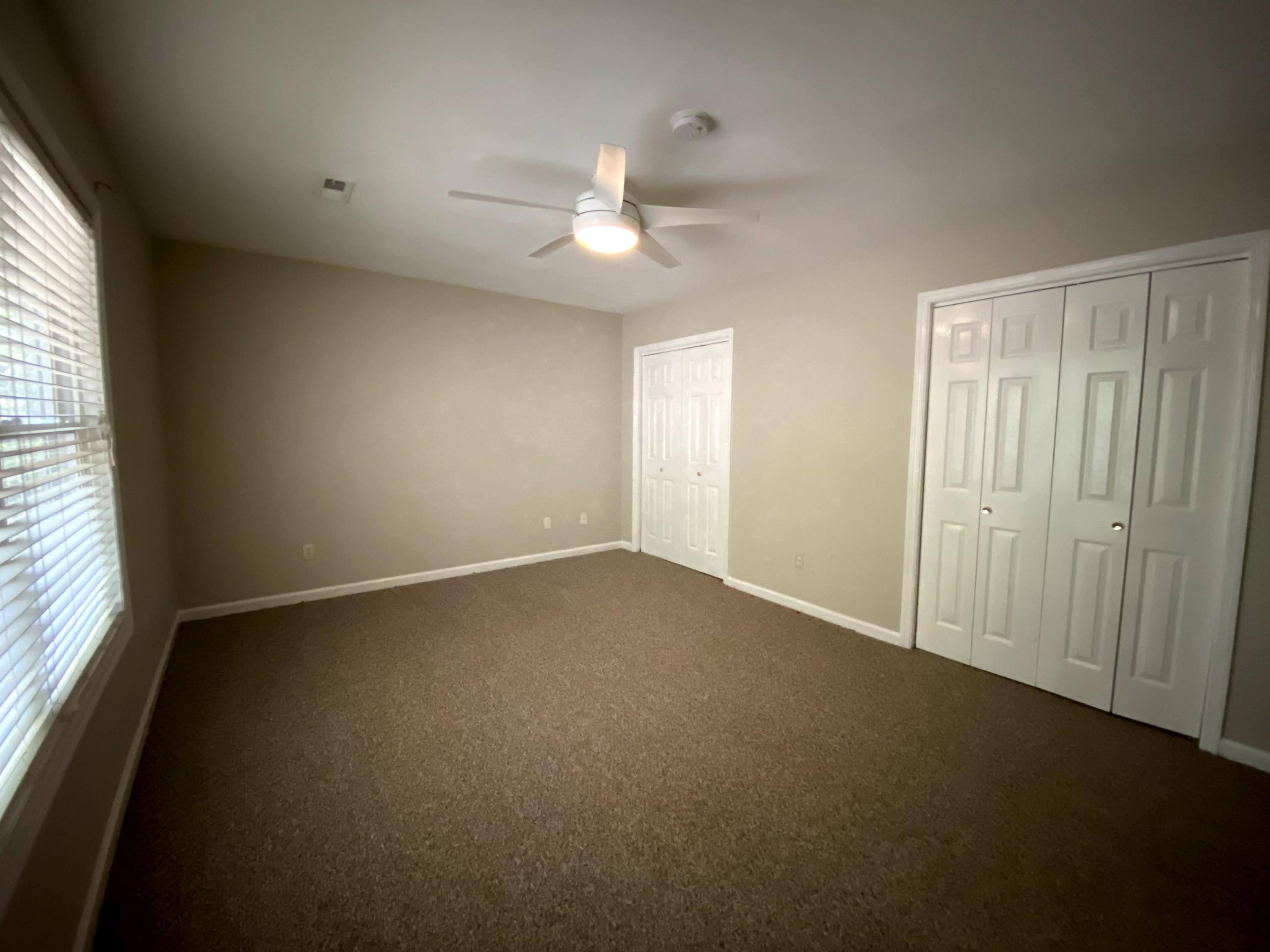 35 Silver Lake Road Hardy, VA 24101 - Photo 39 of 47 an empty room with a chandelier fan and windows