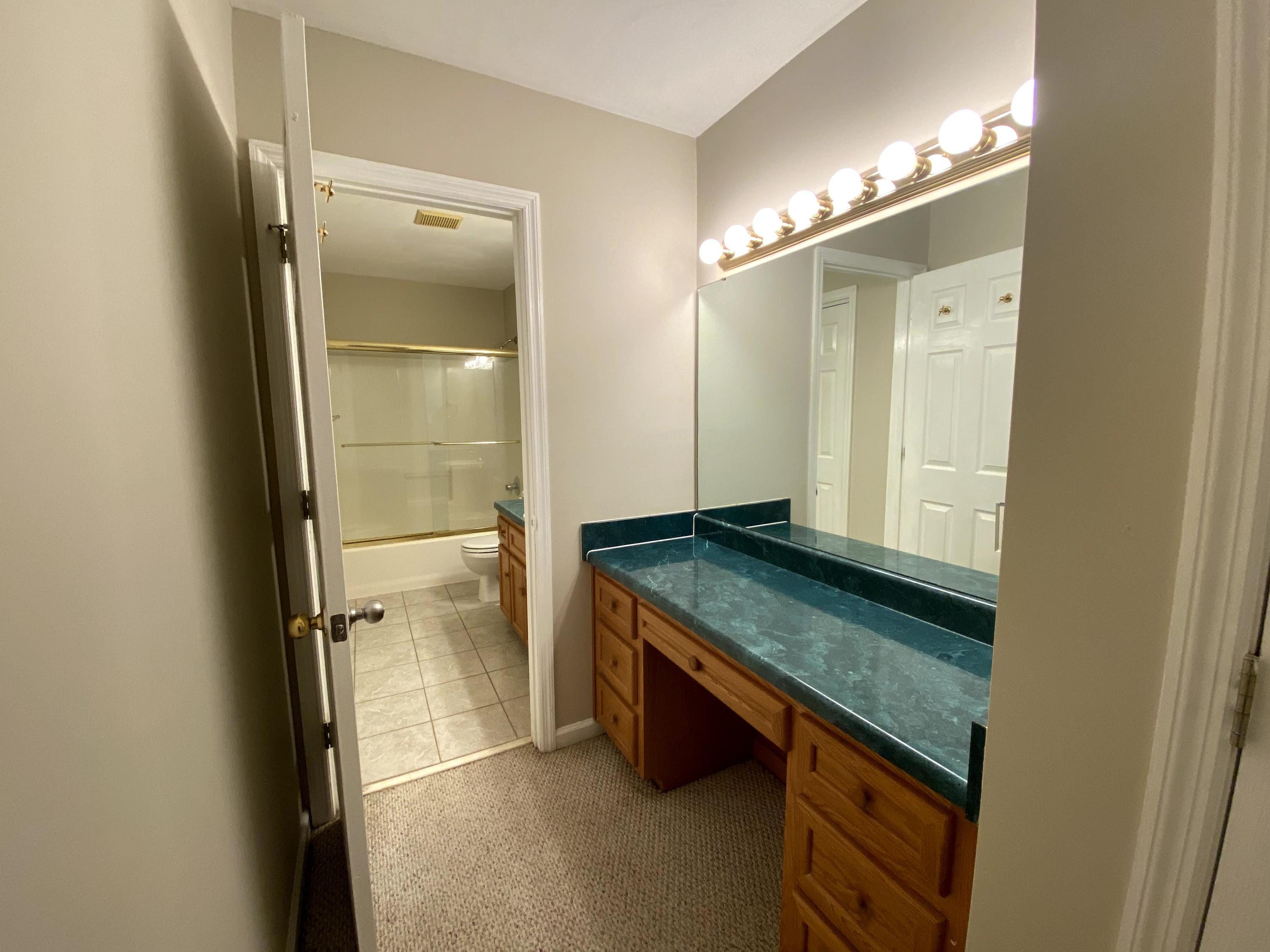 35 Silver Lake Road Hardy, VA 24101 - Photo 41 of 47 a bathroom with a granite countertop sink and a mirror