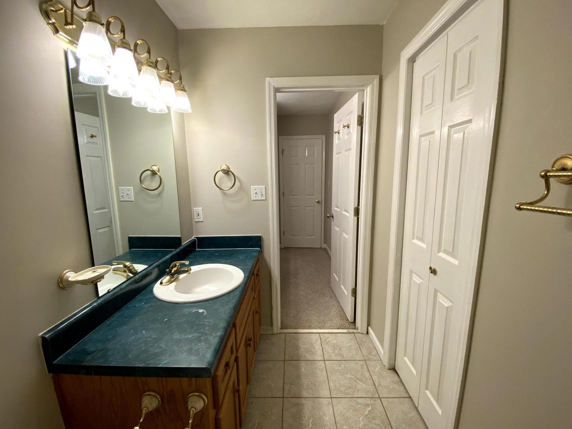 35 Silver Lake Road Hardy, VA 24101 - Photo 44 of 47 a bathroom with a granite countertop sink a toilet and a mirror