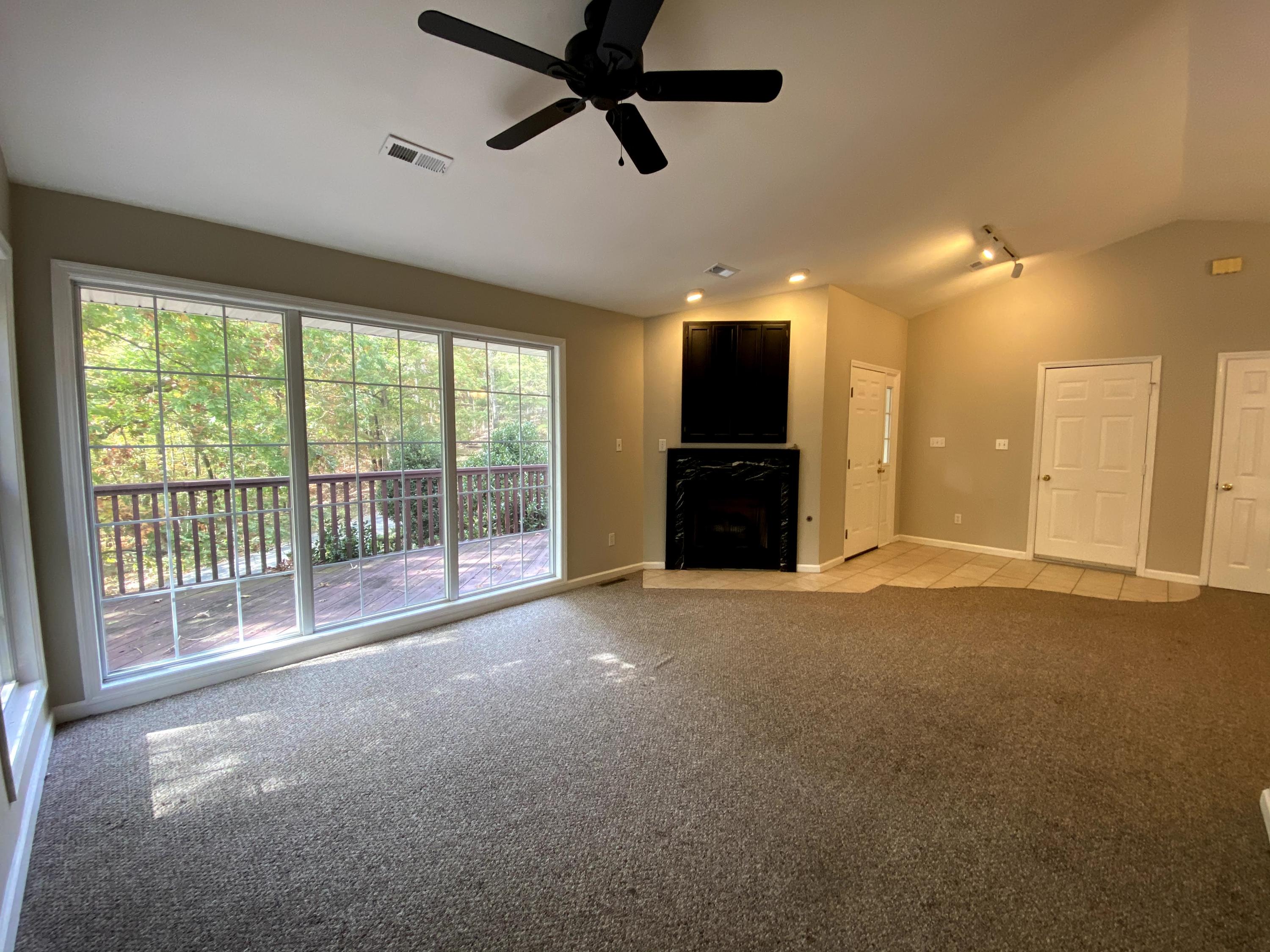 35 Silver Lake Road Hardy, VA 24101 - Photo 8 of 47 a view of empty room with balcony and ceiling fan